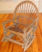 This unusual rocking chair is made of rough wood to give it an old-fashioned look.
