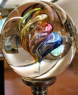 Glass can be made transparent and flat, or into other shapes and colours as shown in this ball from the Verrerie of Brehat in Brittany.