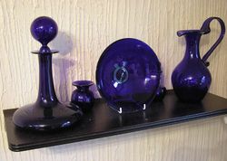 Metallic additives in the glass mix can produce a variety of colours. Here cobalt has been added to produce a bluish coloured decorative glass.