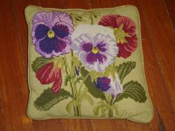 A tapestry cushion, depicting pansies